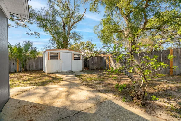 a view of a backyard of the house