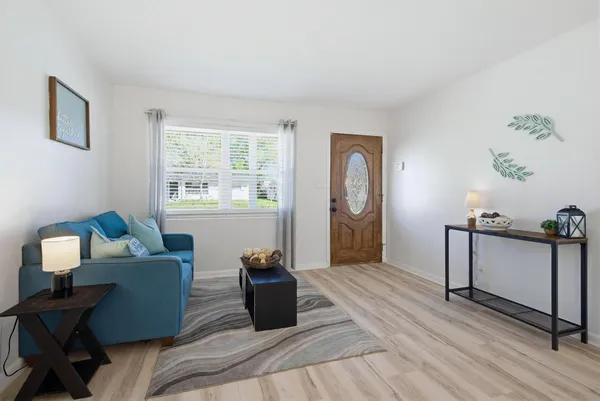 a living room with furniture and a window