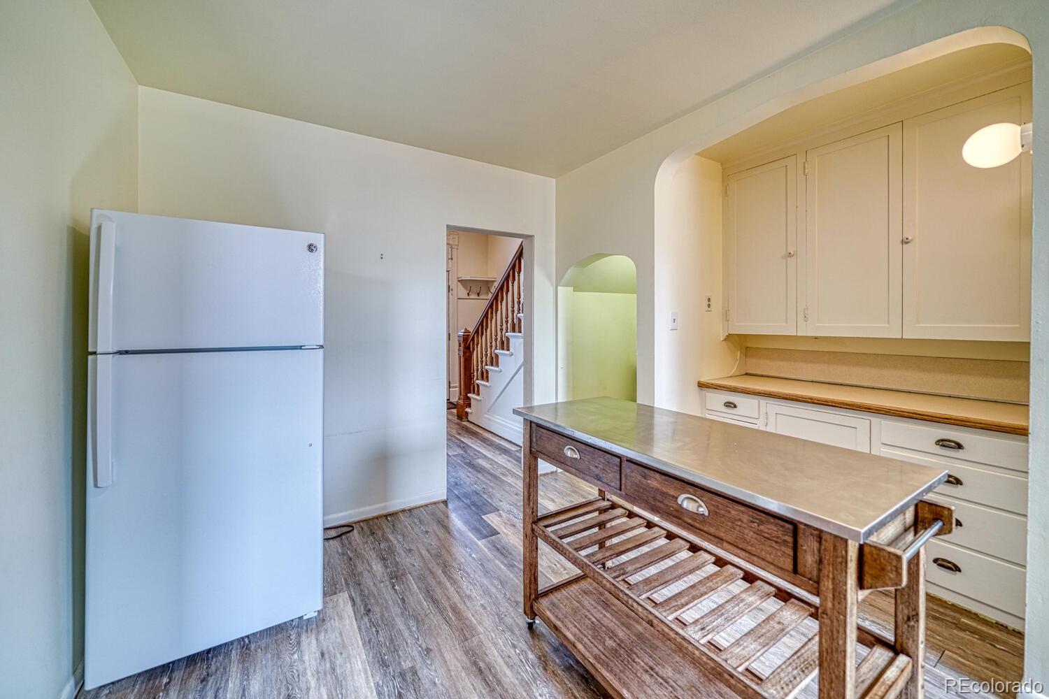 131 E Street Salida, CO 81201 - Photo 15 of 35 a room with a table and a refrigerator