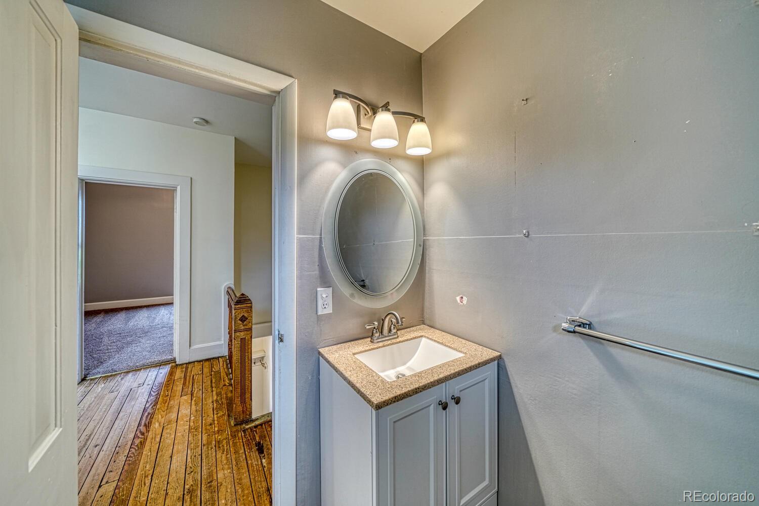 131 E Street Salida, CO 81201 - Photo 29 of 35 a bathroom with a sink and a mirror
