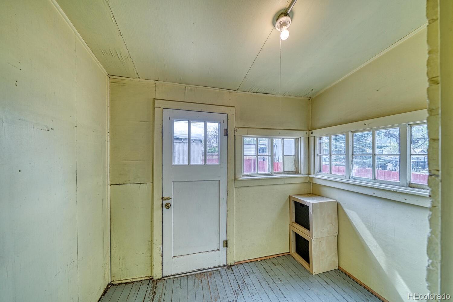 131 E Street Salida, CO 81201 - Photo 30 of 35 a kitchen with stainless steel appliances granite countertop a stove a sink and dishwasher with wooden floor