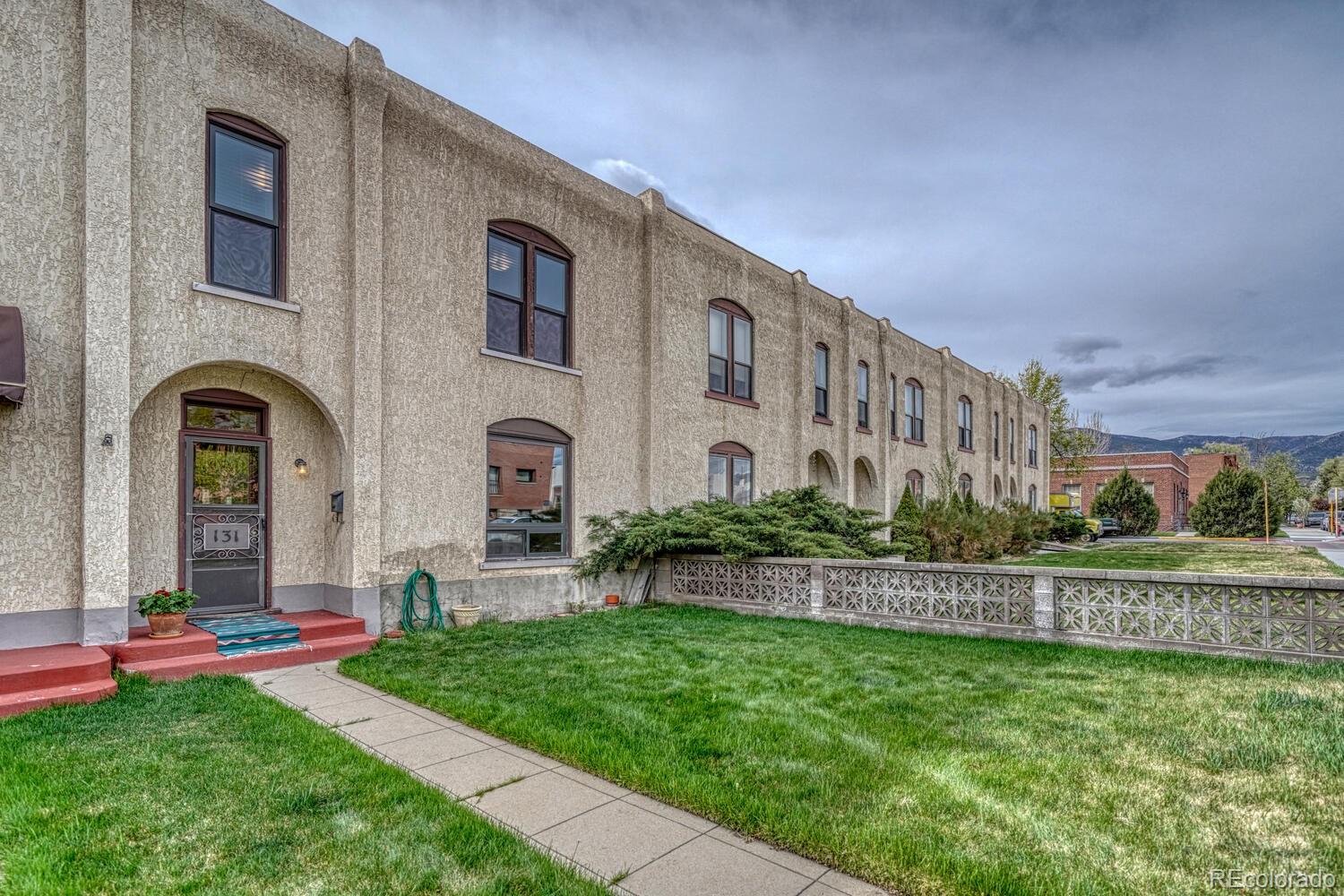 131 E Street Salida, CO 81201 - Photo 3 of 35 a front view of house with yard and green space