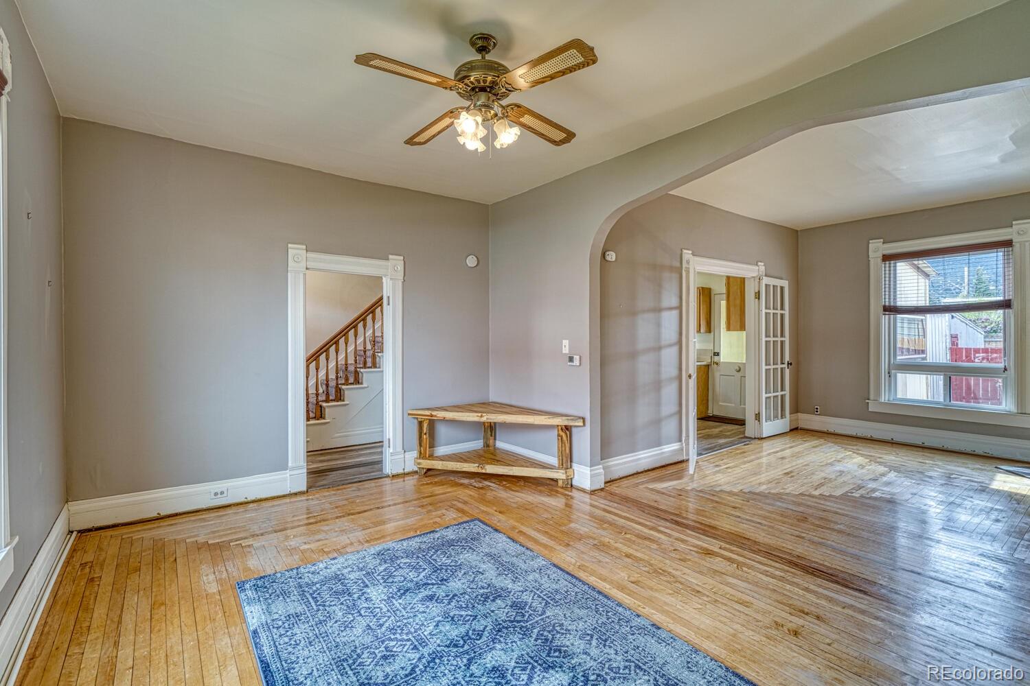 131 E Street Salida, CO 81201 - Photo 7 of 35 wooden floor in an empty room with a window