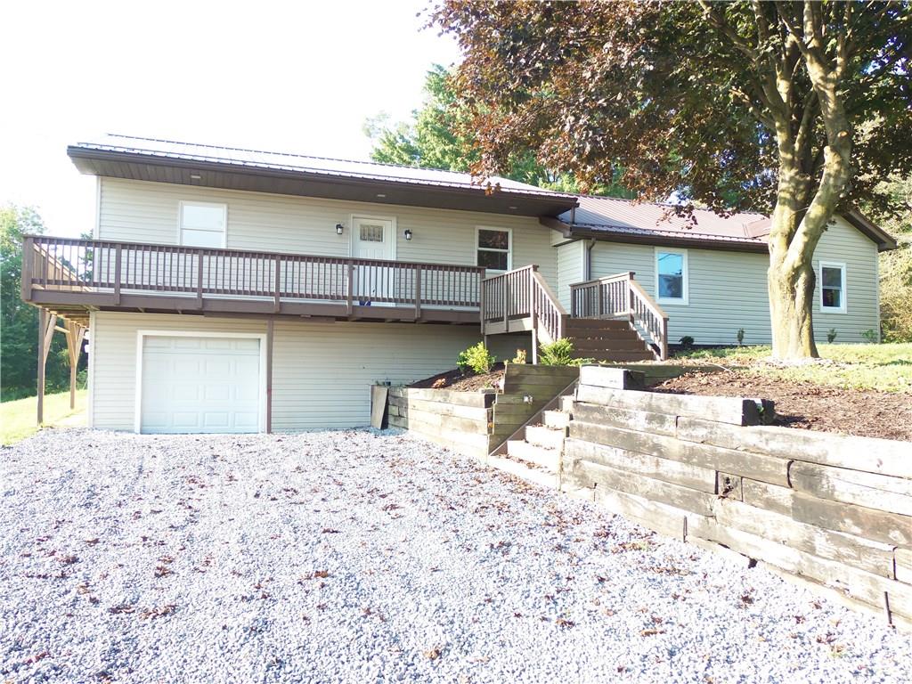 636 Wilson Mill Road New Castle, PA 16105 - Photo 1 of 18 a front view of a house with a yard