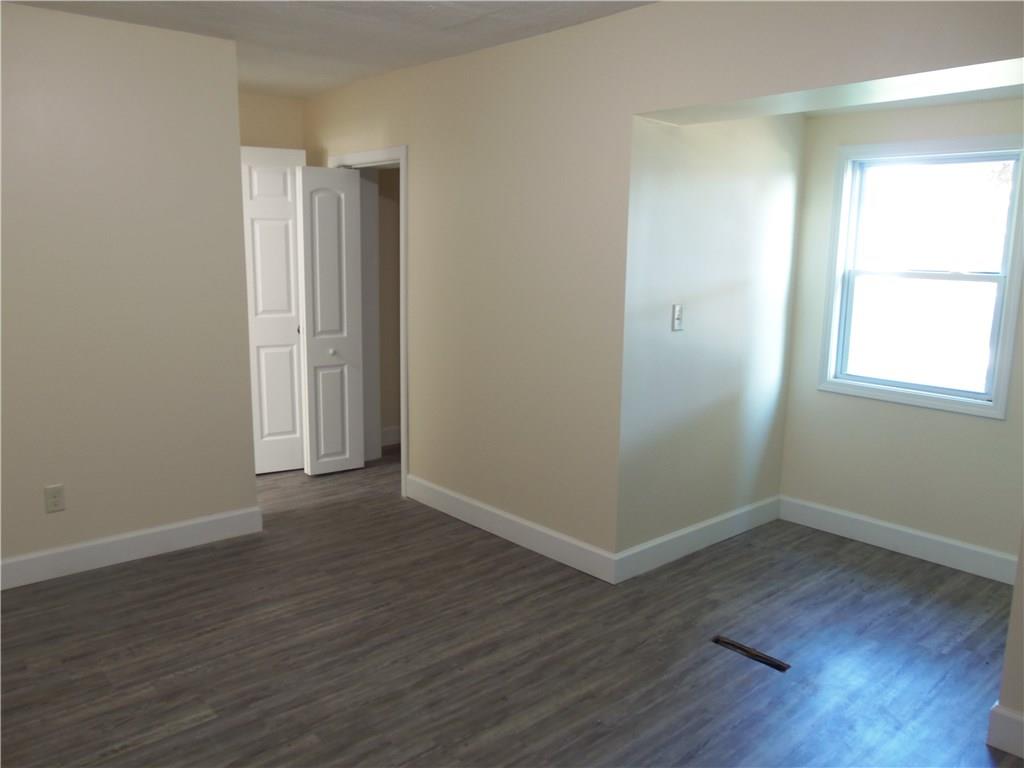 636 Wilson Mill Road New Castle, PA 16105 - Photo 15 of 18 an empty room with wooden floor and window