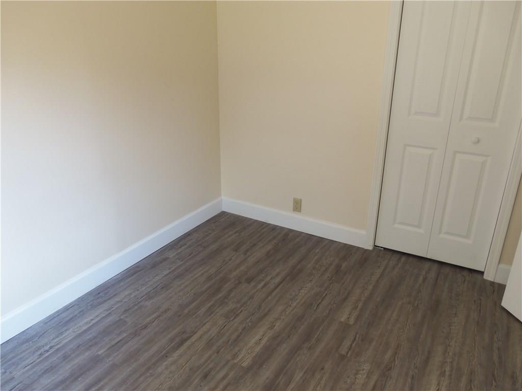 636 Wilson Mill Road New Castle, PA 16105 - Photo 16 of 18 a view of an empty room with wooden floor