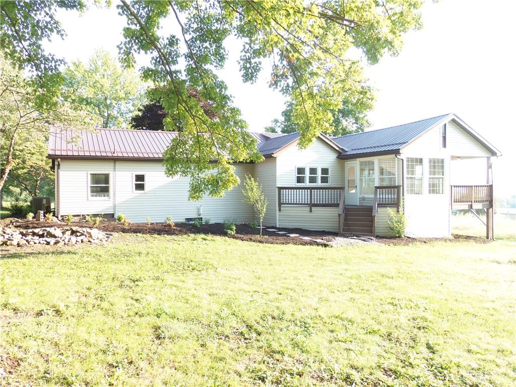 636 Wilson Mill Road New Castle, PA 16105 - Photo 5 of 18 a view of a house with a yard and large tree