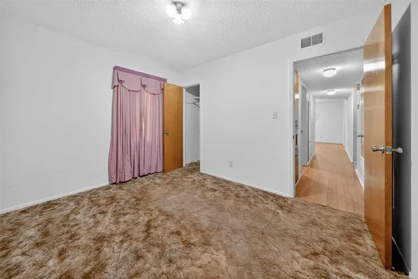 a view of a room with a fireplace