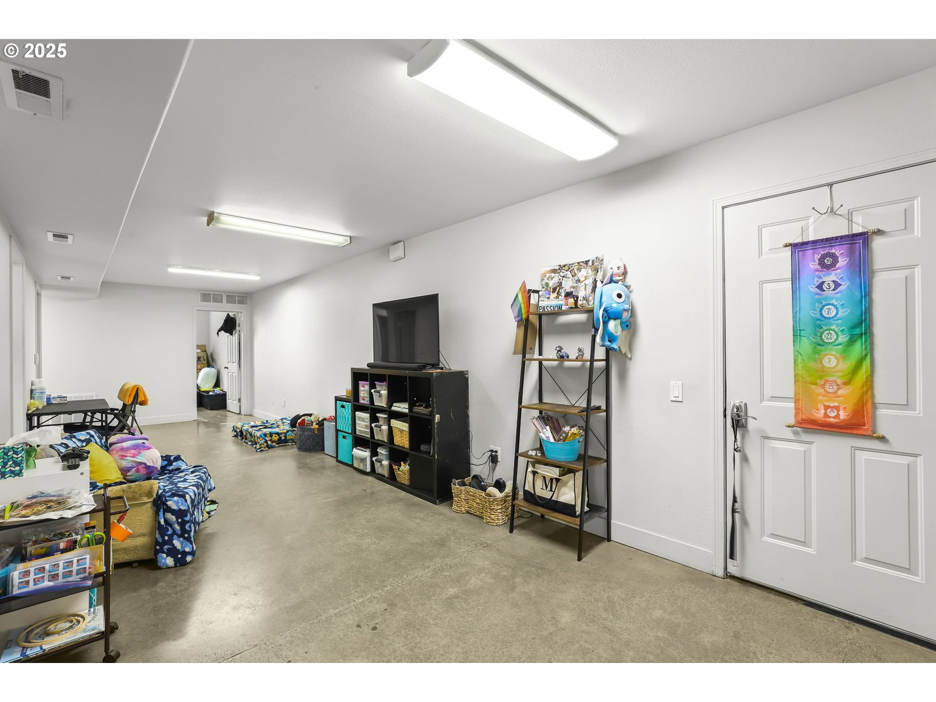 33685 Southeast Kelso Road Boring, OR 97009 - Photo 12 of 32 a living room with furniture and a flat screen tv