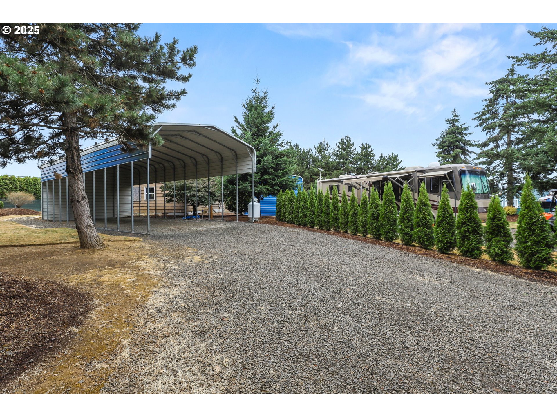 33685 Southeast Kelso Road Boring, OR 97009 - Photo 19 of 32 a view of a grey house with a yard