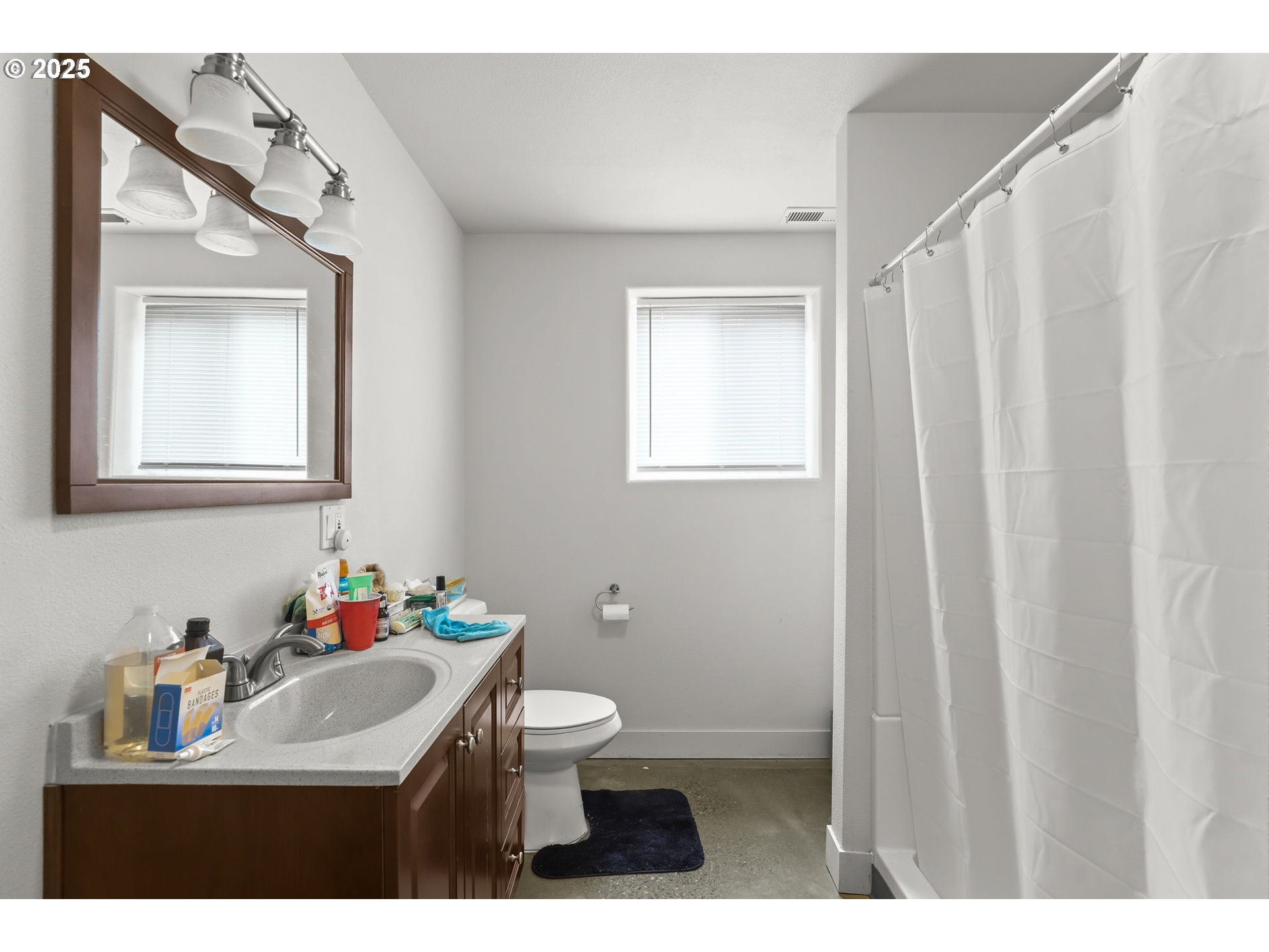 33685 Southeast Kelso Road Boring, OR 97009 - Photo 10 of 32 a bathroom with a sink toilet and a mirror