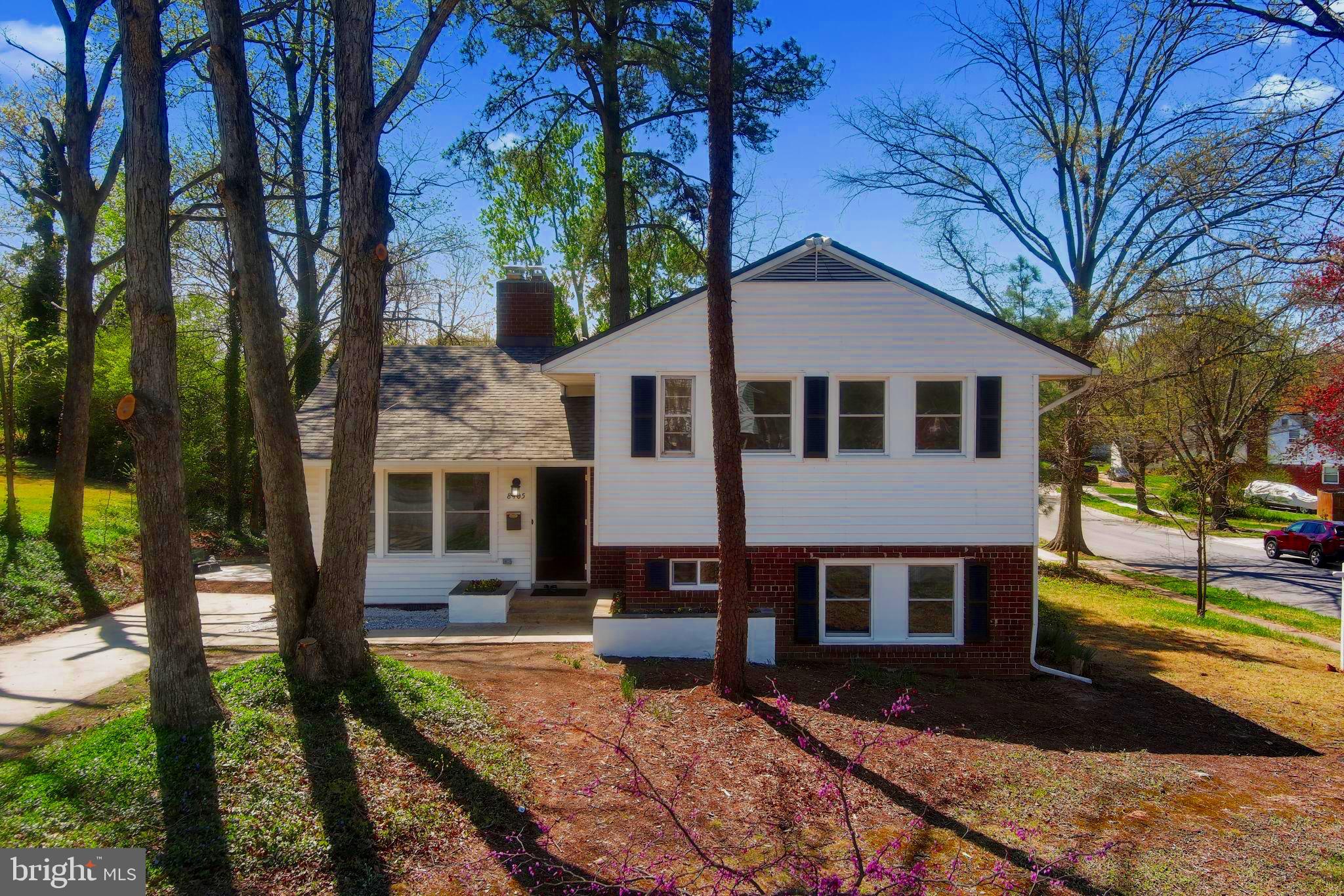 8405 Ravenswood Road New Carrollton, MD 20784 - Photo 1 of 71 a front view of a house with a yard