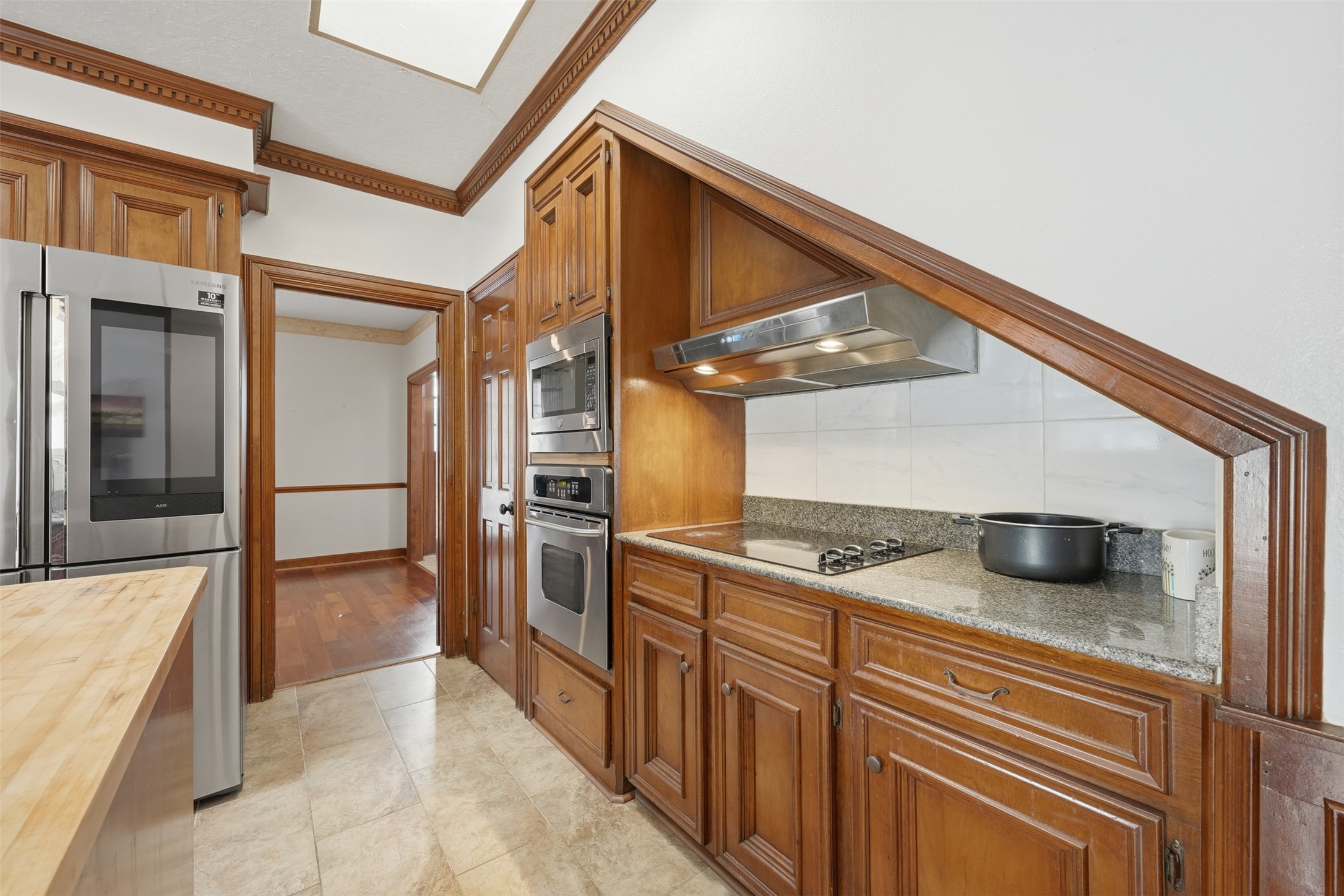 1422 Trace Drive Houston, TX 77077 - Photo 12 of 47 a kitchen with stainless steel appliances granite countertop a sink and cabinets