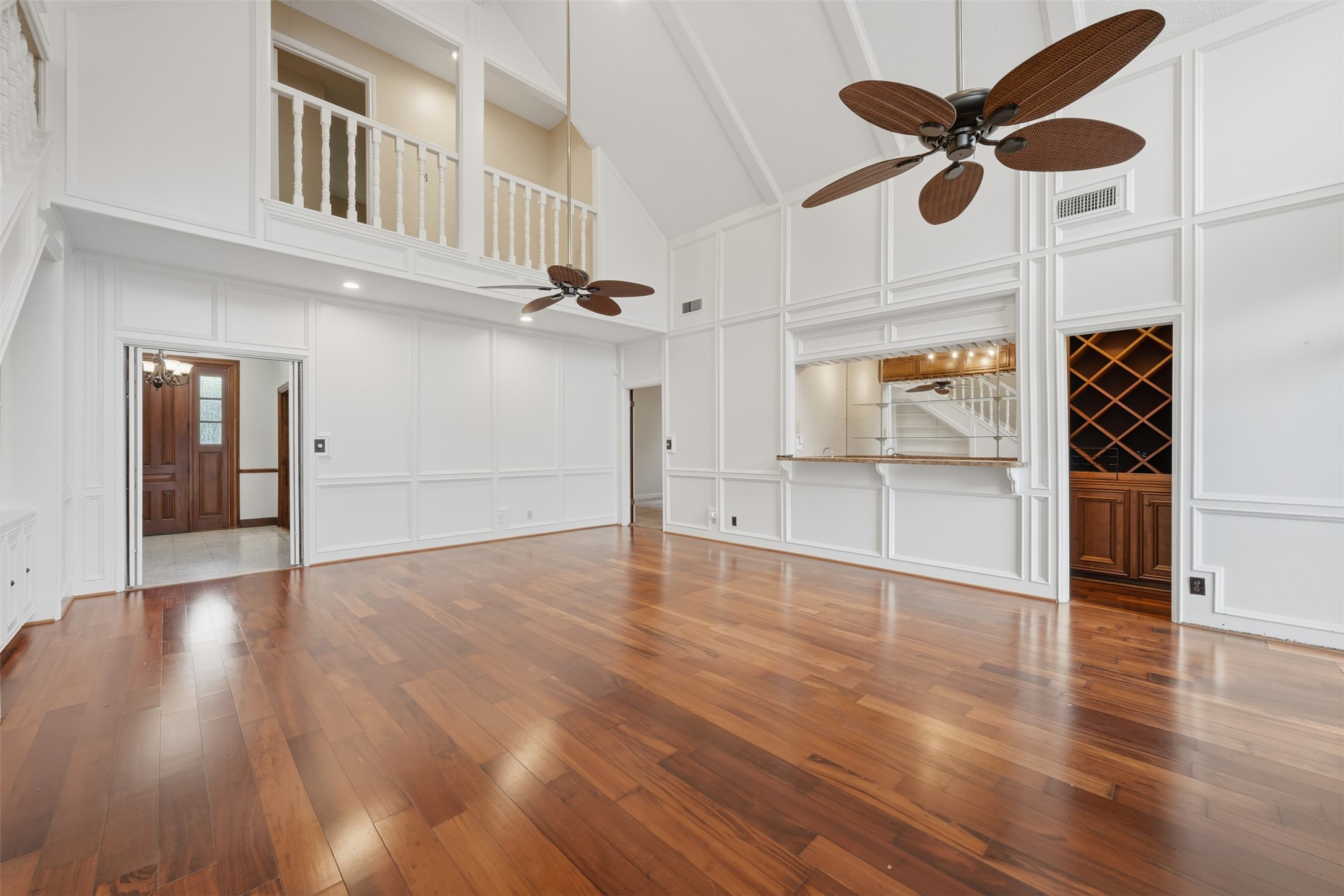 1422 Trace Drive Houston, TX 77077 - Photo 22 of 47 a view of an empty room with a window and wooden floor