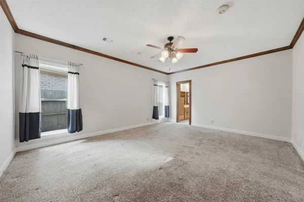 a view of a big room with closet and windows