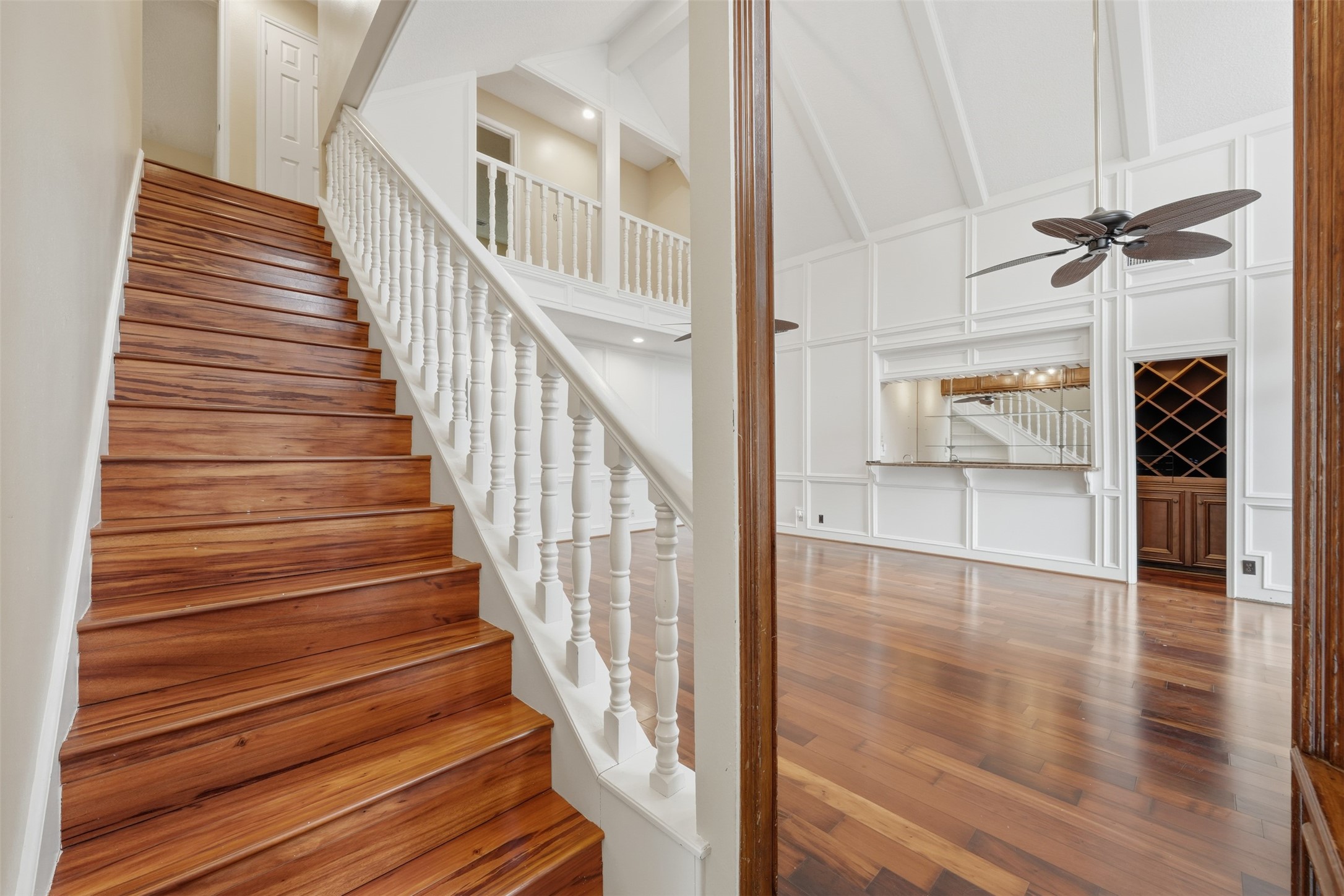 1422 Trace Drive Houston, TX 77077 - Photo 29 of 47 a view of staircase with white walls and chandelier