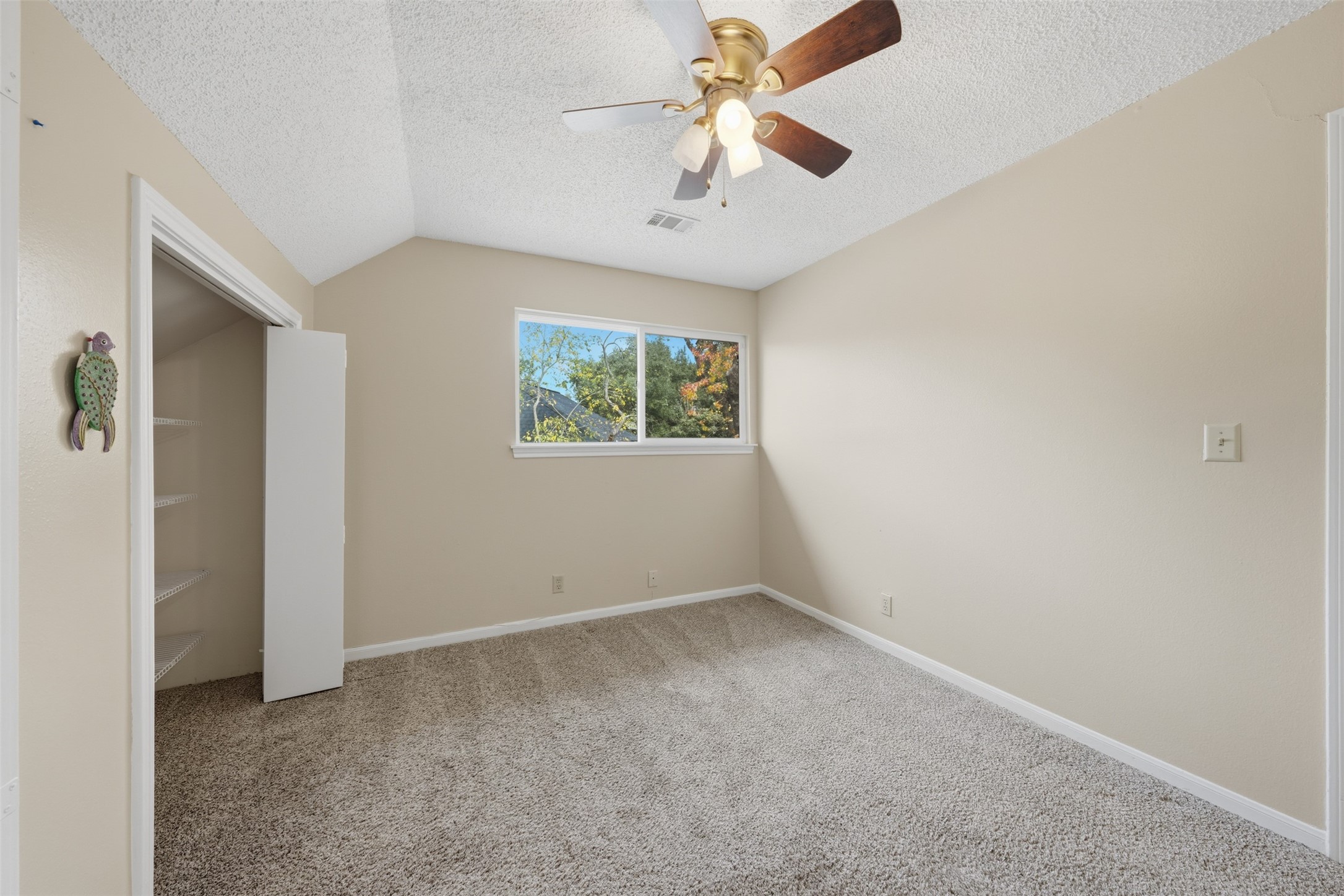 1422 Trace Drive Houston, TX 77077 - Photo 31 of 47 an empty room with windows and fan