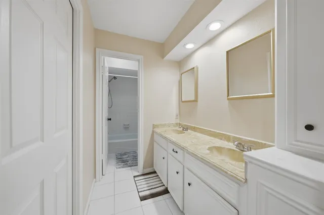 a bathroom with a bathtub shower and toilet