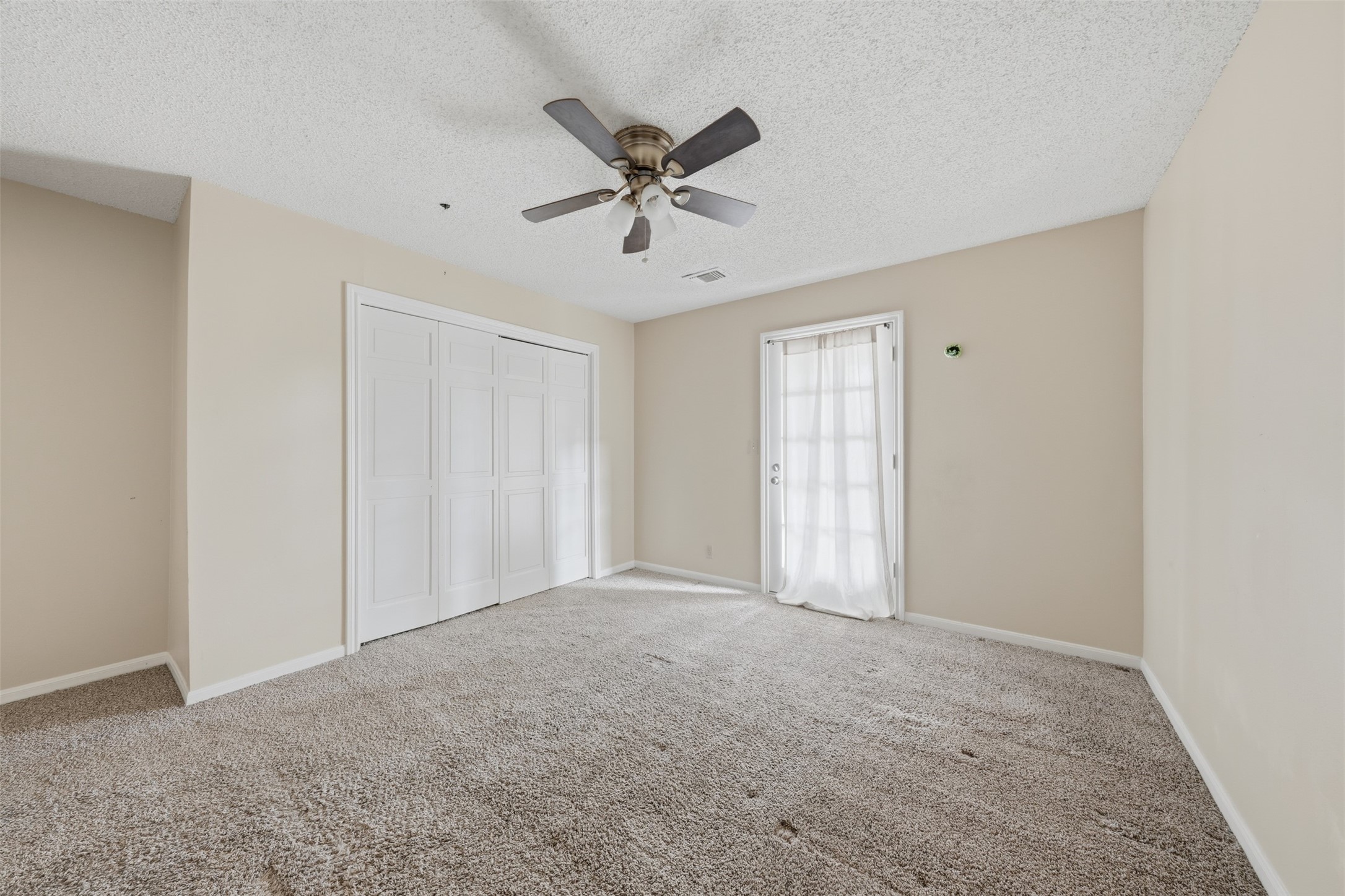 1422 Trace Drive Houston, TX 77077 - Photo 39 of 47 a view of an empty room with a ceiling fan
