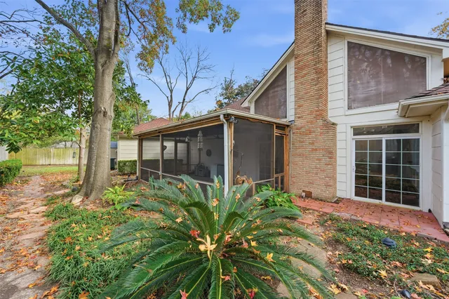 a house with wooden floor in front of it