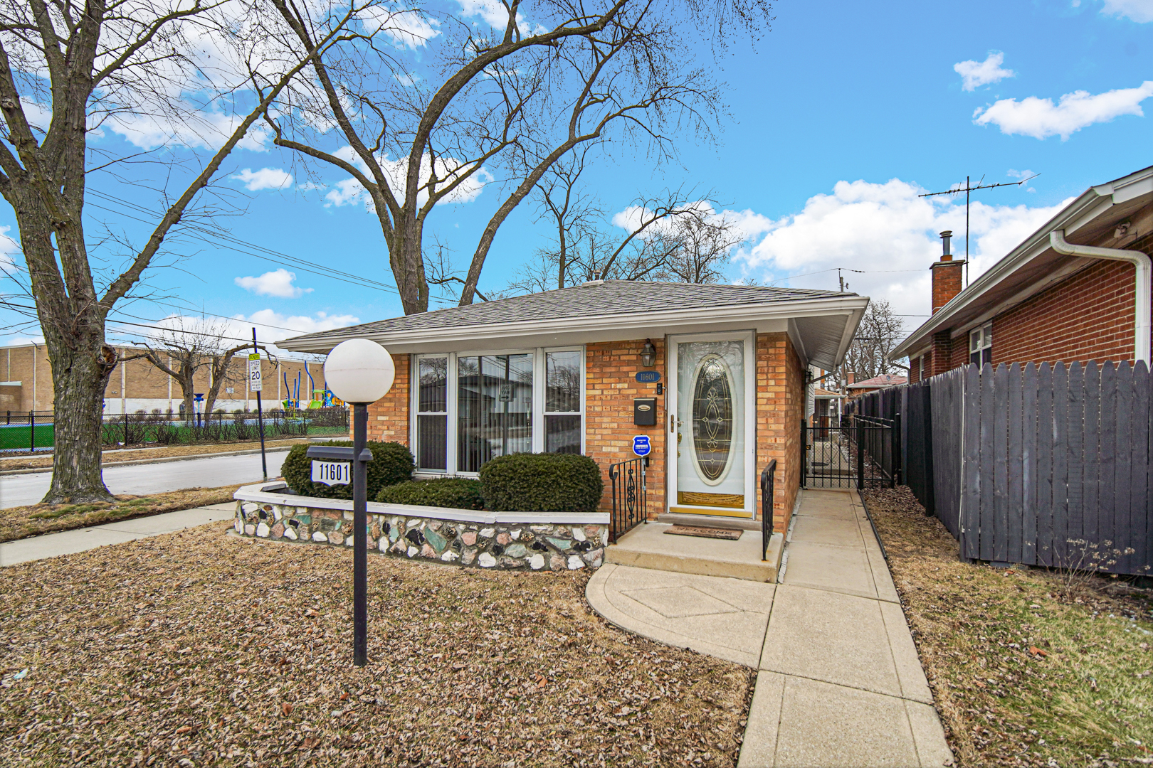 11601 South Ada Street Chicago, IL 60643 - Photo 3 of 20 a front view of a house with garden