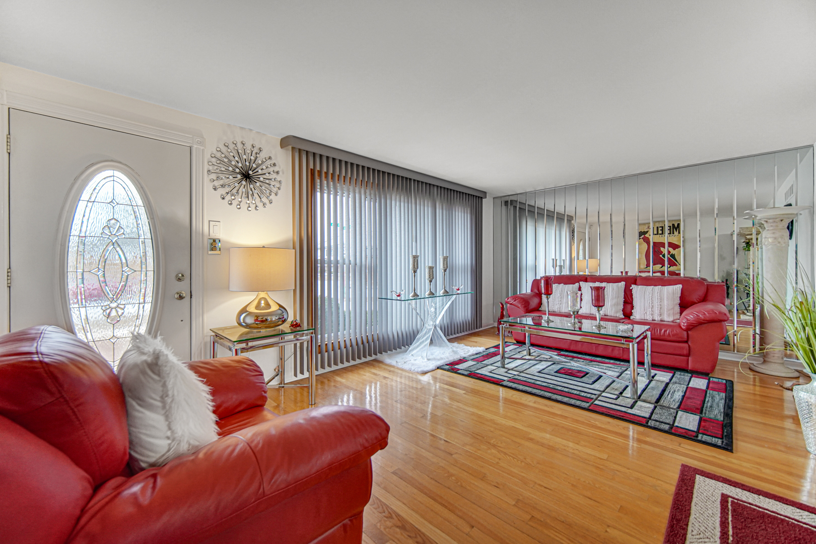11601 South Ada Street Chicago, IL 60643 - Photo 7 of 20 a living room with furniture a large window and a chandelier