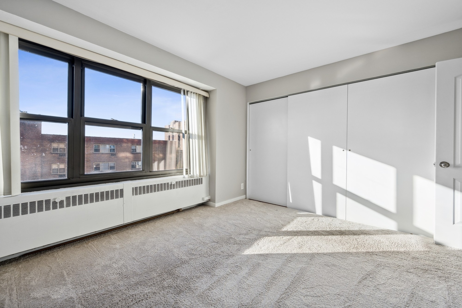 6118 North Sheridan Road, Unit 509 Chicago, IL 60660 - Photo 7 of 10 a view of an empty room with a window
