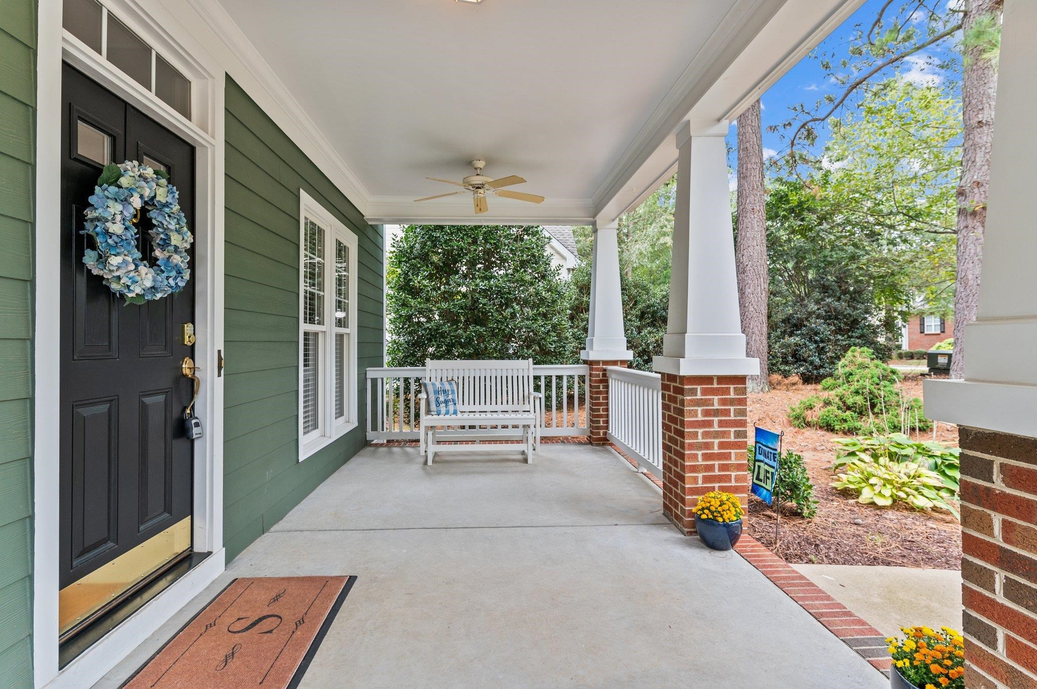 1209 Colonial Club Road Wake Forest, NC 27587 - Photo 3 of 28 The home welcomes you with a deep front covered rocking chair front porch. Front Porch