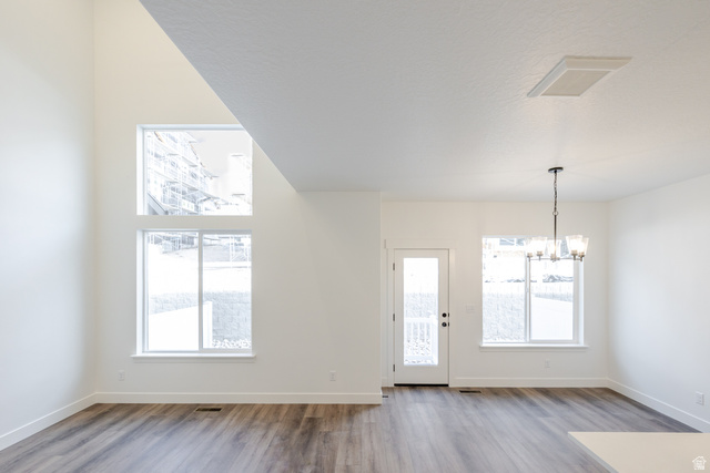 4775 Olive Avenue, Unit 412 Mapleton, UT 84664 - Photo 3 of 19 Entrance foyer with a chandelier and light wood-style flooring