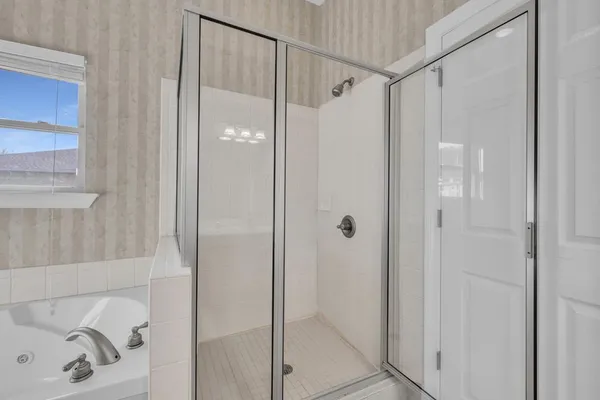 an empty room with an entryway and closet