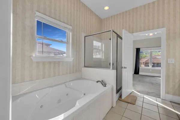a kitchen with stainless steel appliances granite countertop a stove sink and cabinets