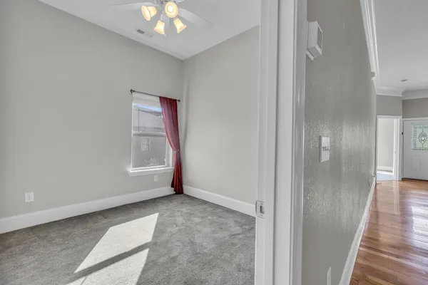 an aerial view of residential houses with outdoor space and lake view