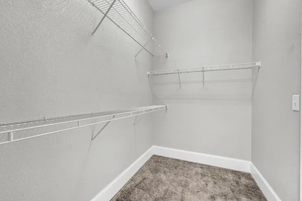 a view of empty room with floor to ceiling window