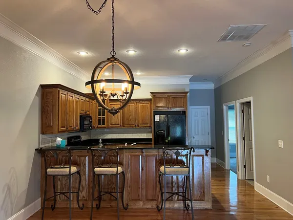 a view of dining room and wooden floor