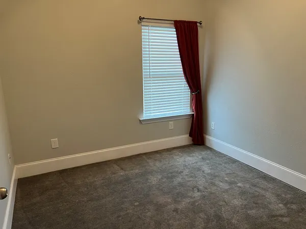 an empty room with a hallway