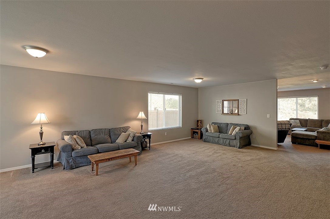 20505 Rustic View Road Southeast Monroe, WA 98272 - Photo 3 of 40 a living room with furniture and a window