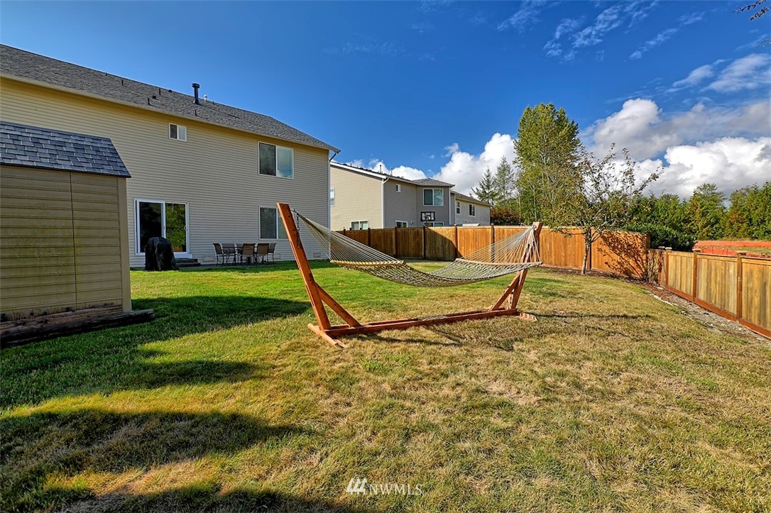 20505 Rustic View Road Southeast Monroe, WA 98272 - Photo 36 of 40 a view of a backyard with plants and a patio
