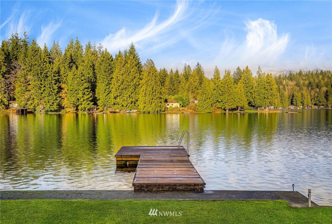 319 West Shore Loop Road Snohomish, WA 98290 - Photo 1 of 32 a view of a lake with a big yard
