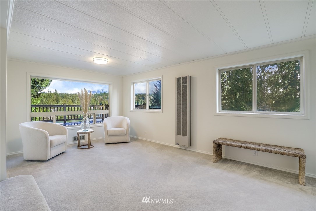 319 West Shore Loop Road Snohomish, WA 98290 - Photo 14 of 32 a living room with furniture and a floor to ceiling window