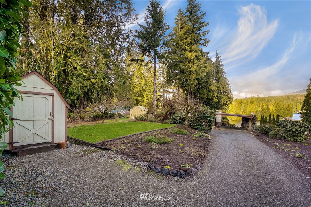 319 West Shore Loop Road Snohomish, WA 98290 - Photo 28 of 32 a view of a yard with plants and trees