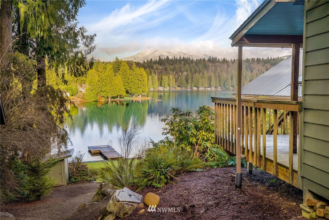 319 West Shore Loop Road Snohomish, WA 98290 - Photo 5 of 32 a view of a lake with a garden