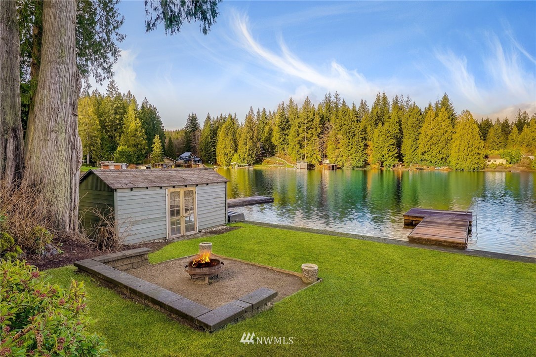 319 West Shore Loop Road Snohomish, WA 98290 - Photo 10 of 32 a view of a swimming pool with lounge chairs in patio