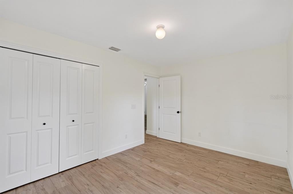 171 William Street Edgewater, FL 32141 - Photo 17 of 40 a view of an empty room with wooden floor