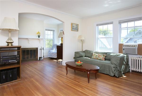 99 Westbourne Terrace, Unit 2 Brookline, MA 02446 - Photo 2 of 6 a living room with furniture and a fireplace