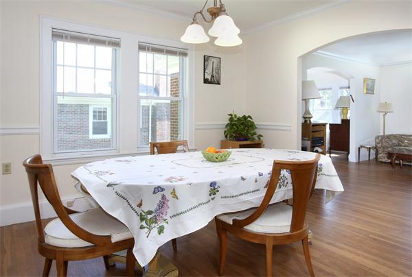 99 Westbourne Terrace, Unit 2 Brookline, MA 02446 - Photo 3 of 6 a view of a dining room with furniture and wooden floor