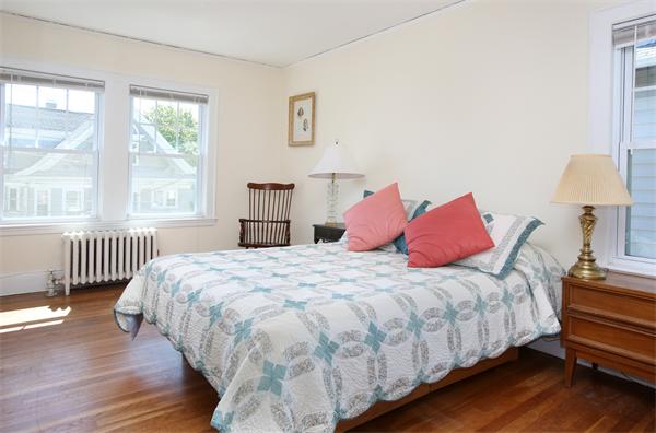 99 Westbourne Terrace, Unit 2 Brookline, MA 02446 - Photo 5 of 6 a bedroom with a bed and a window