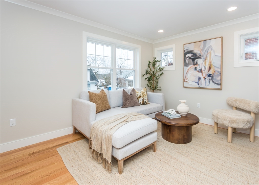89 Hardy Pond Road Waltham, MA 02451 - Photo 7 of 39 a living room with furniture and a large window