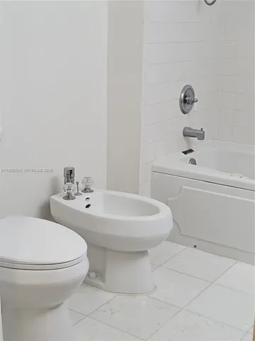a bathroom with a sink and cabinets