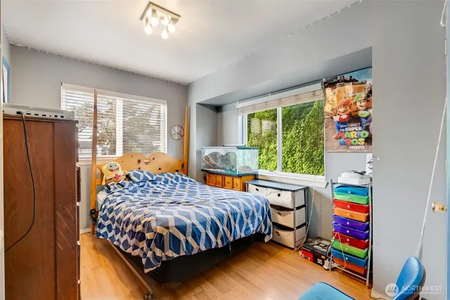 a bedroom with a bed and a window