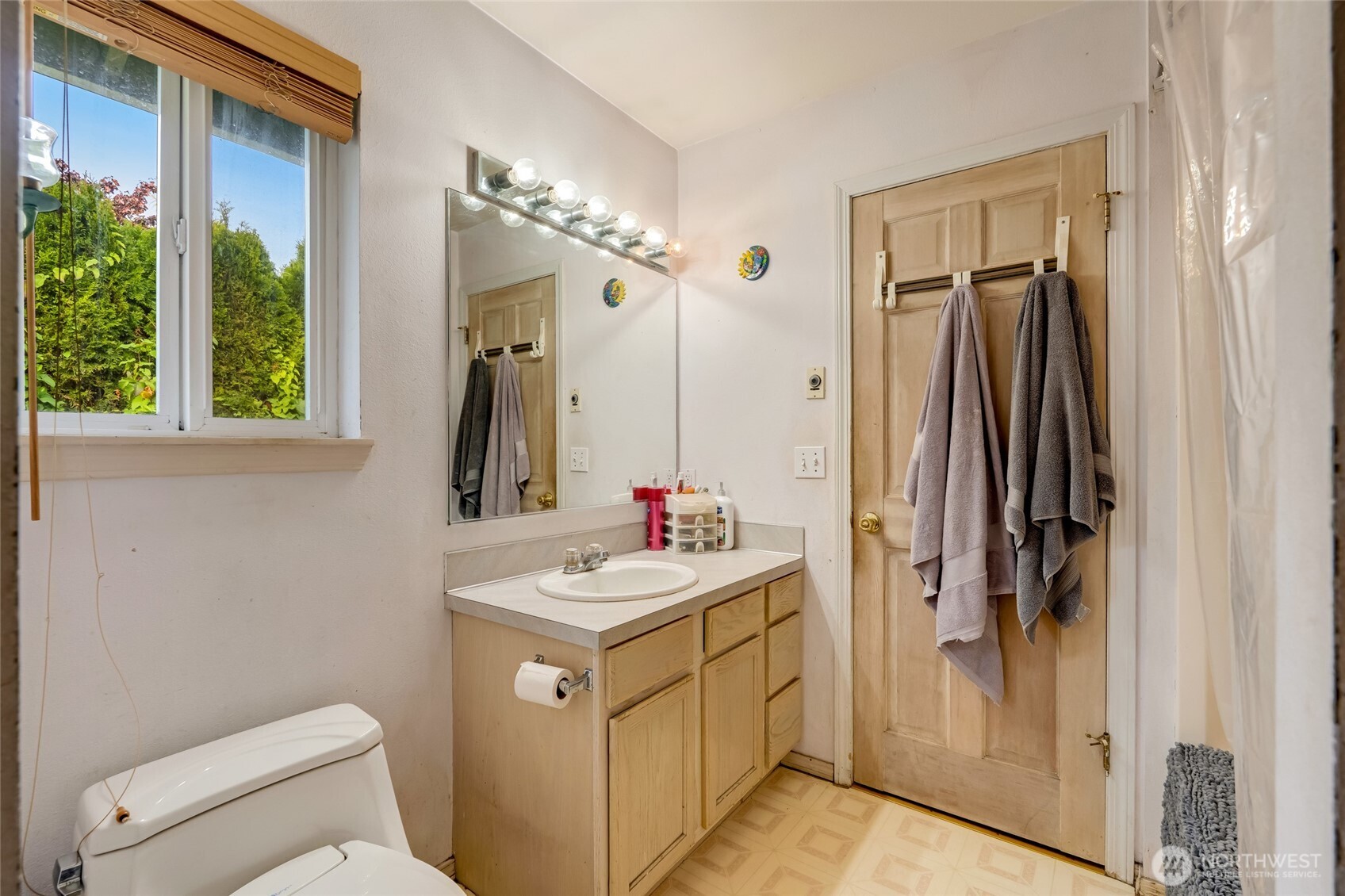 319 6th Street Blaine, WA 98230 - Photo 16 of 24 a bathroom with a sink a toilet and shower